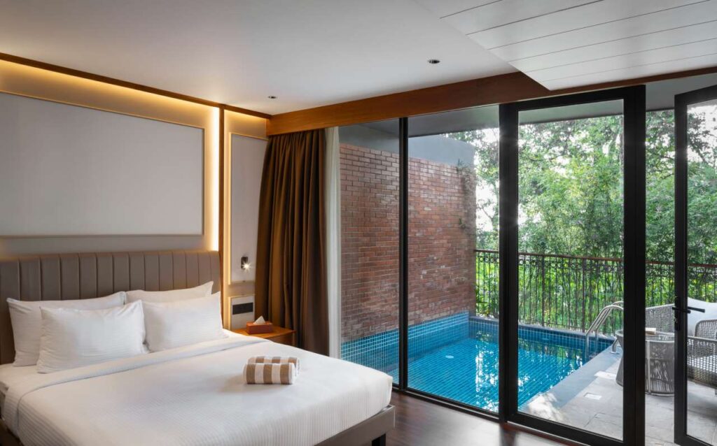 Alt Text: Luxury bedroom with private pool at Lords 83 – a premium family resort in Wayanad