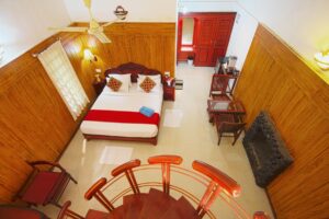Spacious and comfortable rooms at Misty Woods Resort in Coorg with modern interiors and plantation views