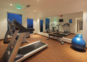 Modern fitness centre at Monsoon Empress Kochi with advanced gym equipment