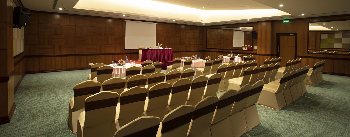 Alt Text:Modern conference hall at Monsoon Empress in Kochi set up for rainbow events, corporate meetings, conferences, and business gatherings with professional seating arrangement and presentation setup.